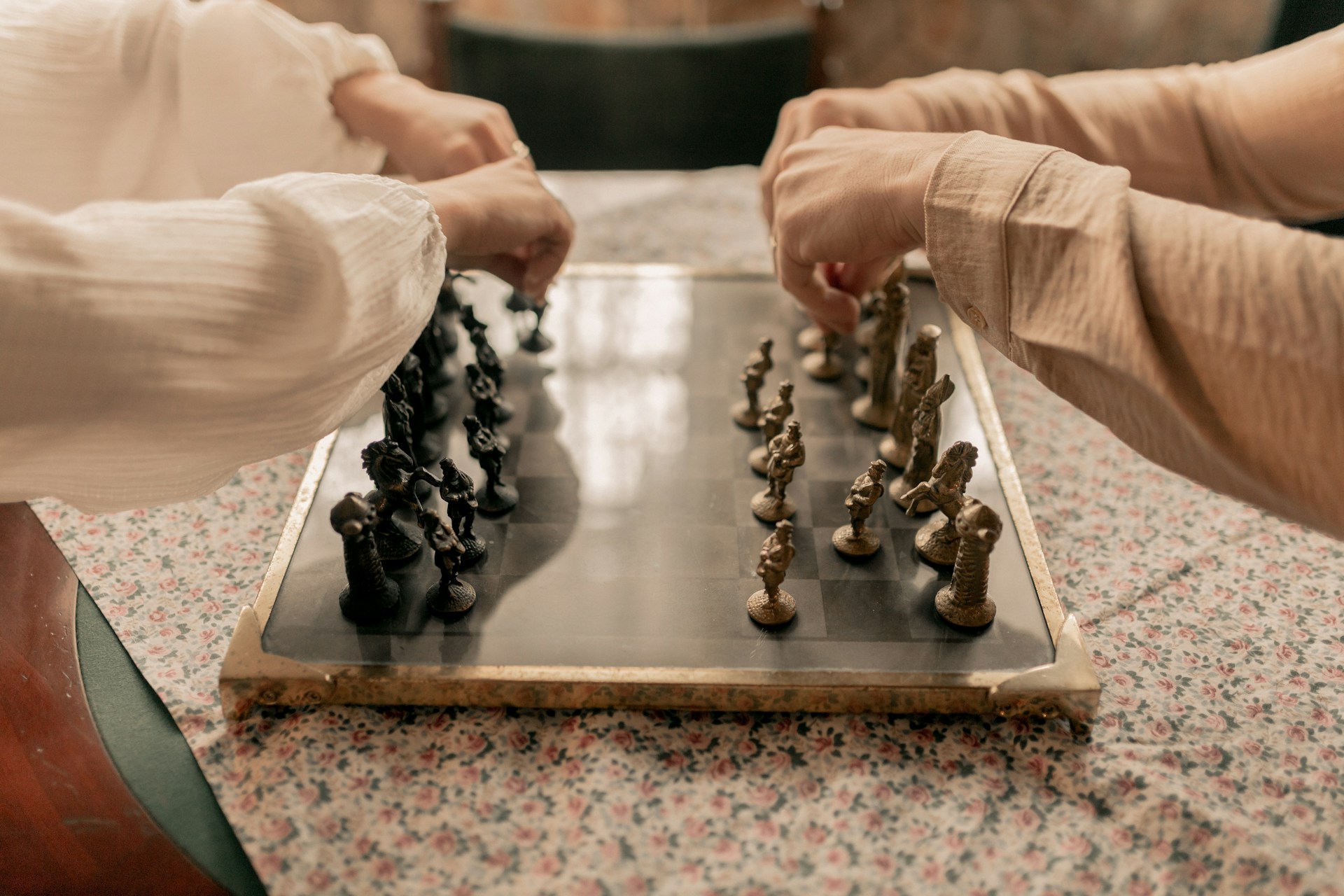 two-people-playing-a-game-of-chess-on-a-table