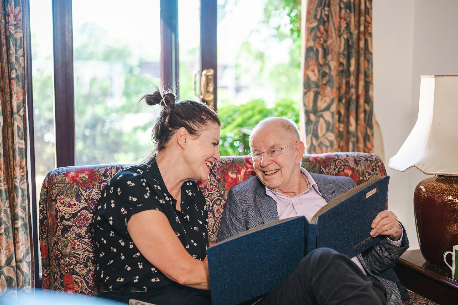 man and woman sitting on the couch